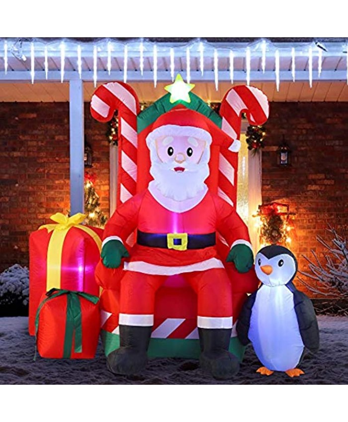 Joiedomi 6 FT Tall Santa Claus on Candy Throne Inflatable with Build-in LEDs Blow Up Inflatables for Xmas Party Indoor Outdoor Yard Garden Lawn Winter Decor.
